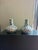 Pair of blue and white porcelain hand-painted vases featuring detailed floral and foliate motifs throughout. Each vase has...