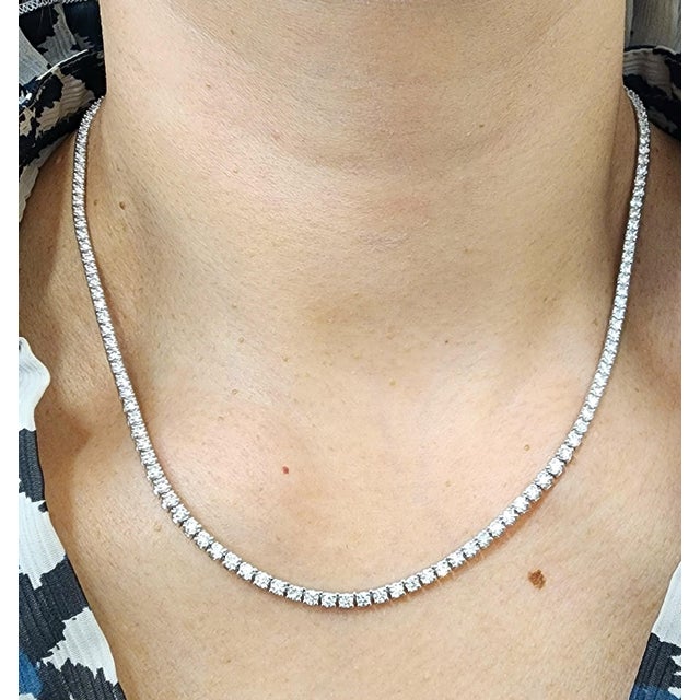 This beautiful tennis necklace features 6.5 carats of 151 round-cut white diamonds. The diamonds are set in 14k white...