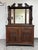 Design Plus Gallery presents a Victorian Carved Mahogany Triple Mirror Sideboard. This antique sideboard presents a grand...