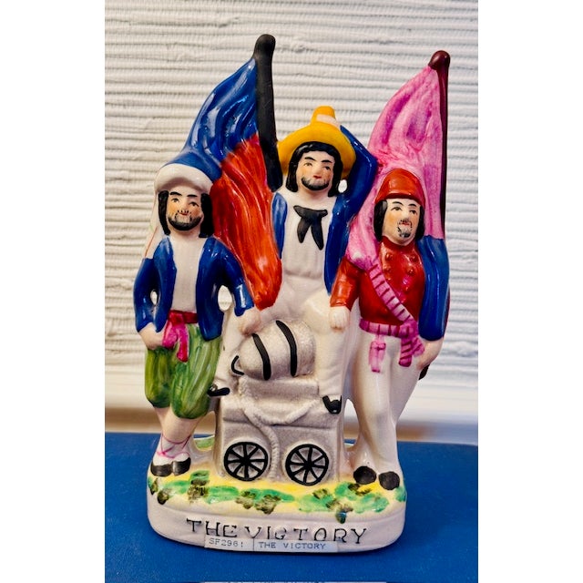 A rare and distinguished set of three of antique Staffordshire flatback figurines depicting naval and military scenes....