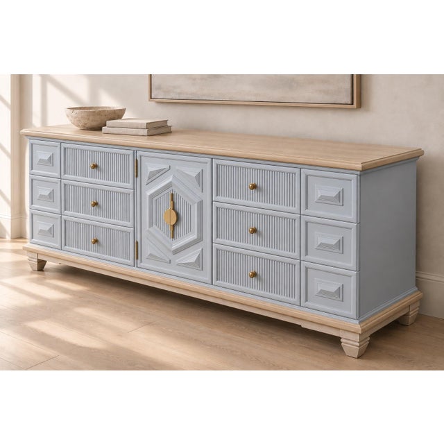 A beautifully restored vintage Thomasville nine-drawer dresser featuring exceptional solid wood construction, generous...