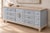 A beautifully restored vintage Thomasville nine-drawer dresser featuring exceptional solid wood construction, generous...