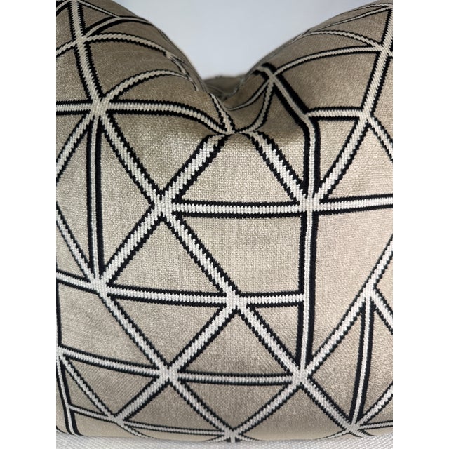 Custom pair of 22" pillows covered in a soft printed velvet in a modern pattern. The background color is a silver color...