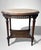 Elegant Italian side table from the early 20th century, crafted in finely worked solid walnut and enriched by a refined...