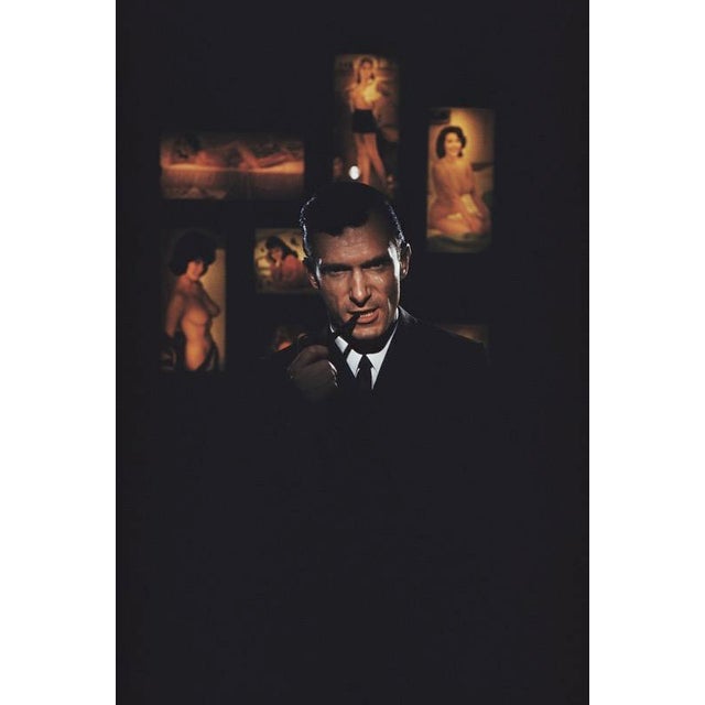 Hugh Hefner 1961 American publisher Hugh Hefner, founder of ‘Playboy’ magazine, surrounded by erotica at the Playboy Club...