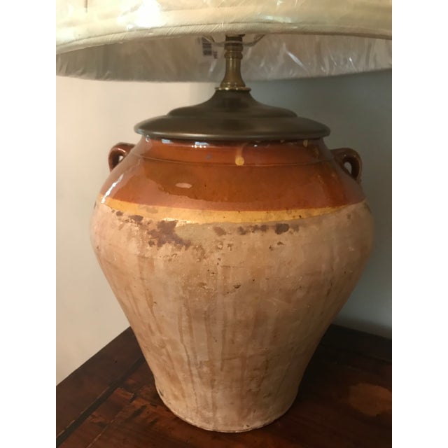 Lovely Antique Italian olive jar made into lamp with nice complimentary shade. 23” to Top of Finial. 10” at Widest.