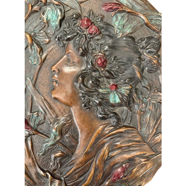An elaborate Art Nouveau sculptural relief plaque bearing the signature “A. Mucha” on the reverse, featuring an elegant...