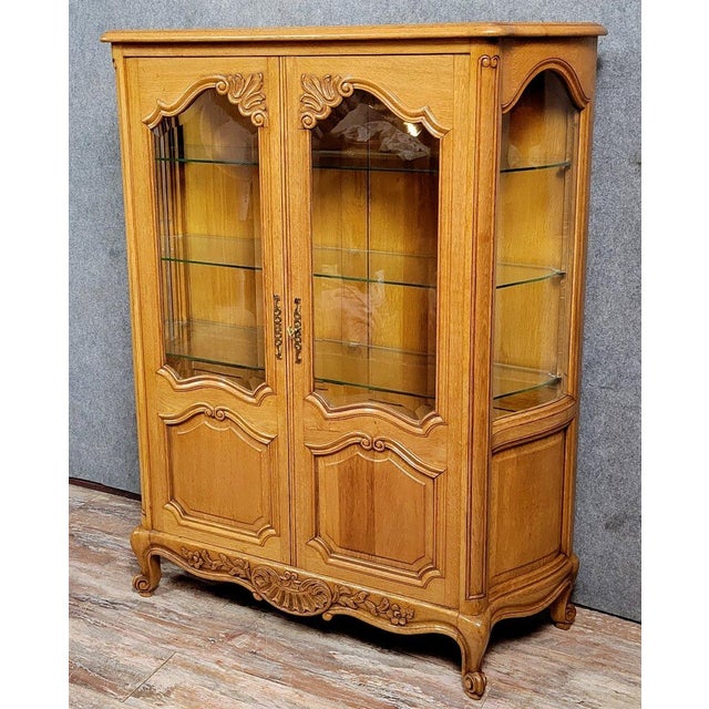 Louis xv style curved display cabinet in light oak, circa 1950 front opening with two molded and carved doors parqueted...