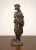 A high-quality bronze statue of a young woman in an allegorical concept, depicting the personification of spring. The...
