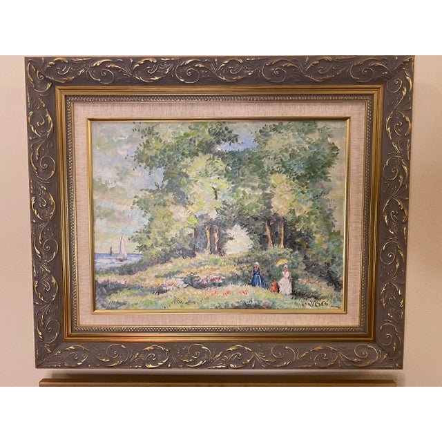 This beautifully framed pair of oil on canvas paintings in the impressionist style depicts lovely seaside scenes using a...