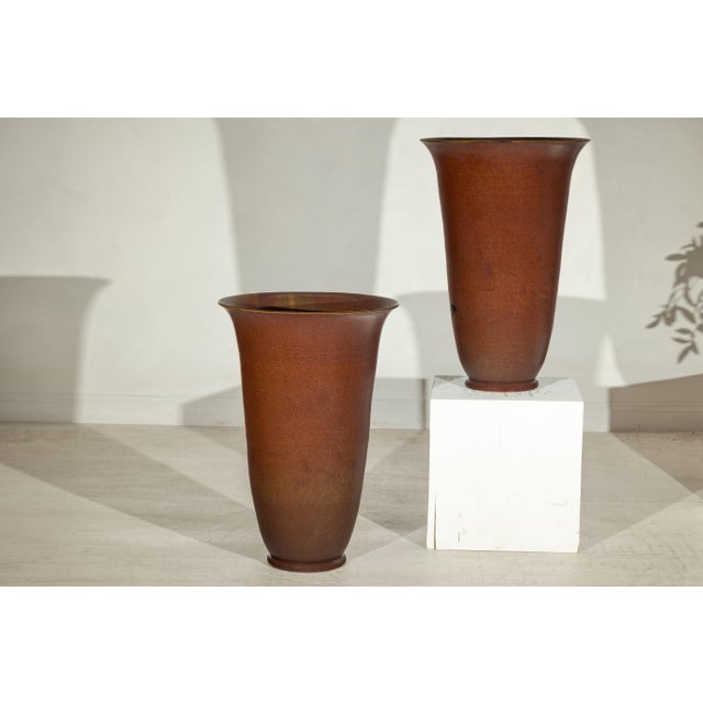 "About the Item This refined pair of artisan ceramic vases is defined by their elegant trumpet-form silhouettes and richly...