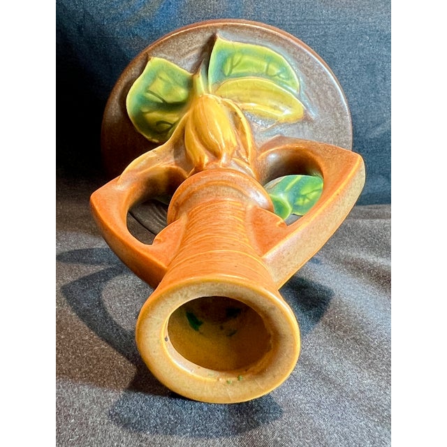 Pair of Roseville Water Lily Candlesticks,slight chip on one. See photos