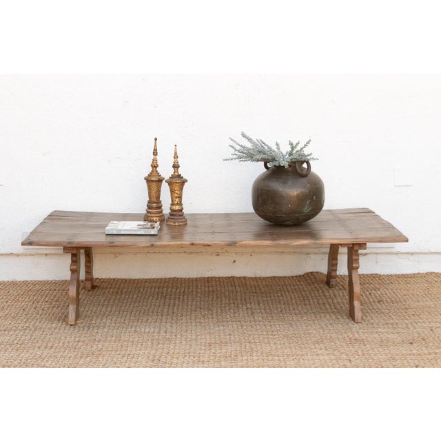 This monumental coffee table is a rare architectural find from South India, embodying the raw, grounded elegance of Modern...