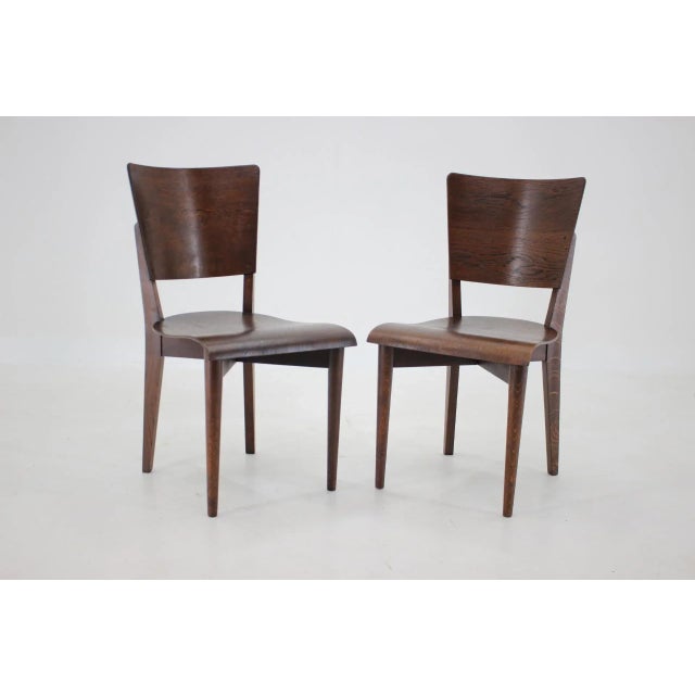 Carefully refurbished, labeled by producer. Height of seat 45 cm. This piece is attributed to the mentioned...