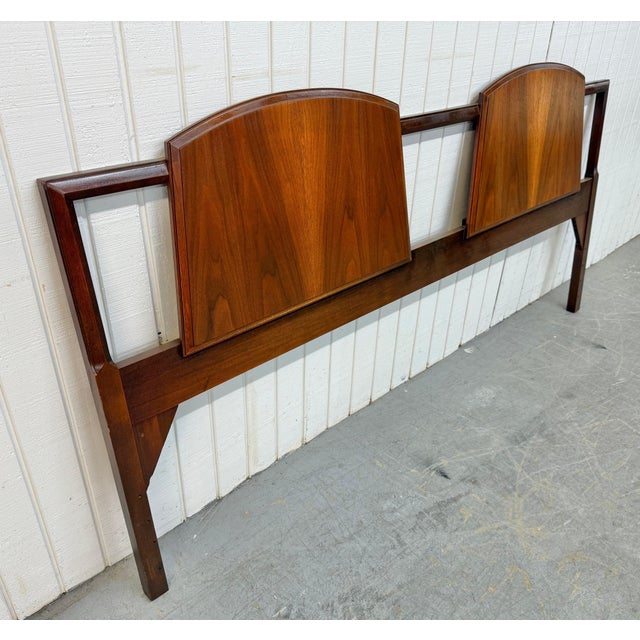This hard-to-find Mid-Century Modern Lane First Edition king-size walnut headboard is a stunning example of iconic...