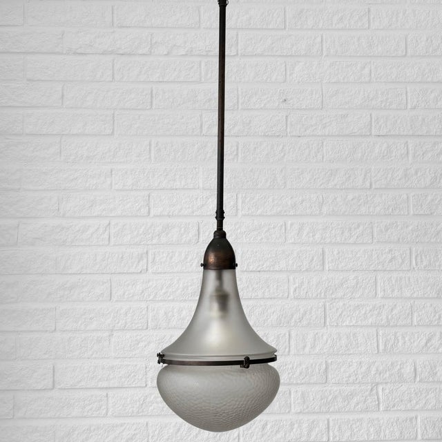 A Luzette pendant lamp, often attributed to the German architect Peter Behrens. The model was originally developed for...