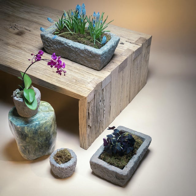 Once a common sight in courtyards throughout rural China, this textured stone vessel was used as a grain or water trough...