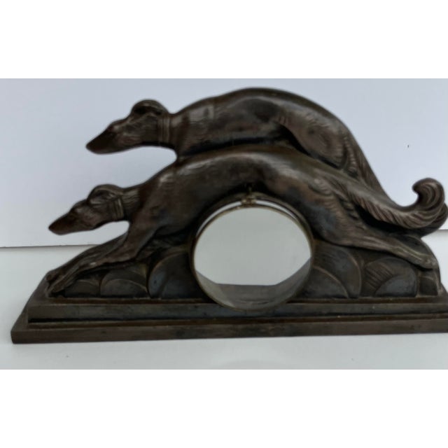 Wonderful Pair of French Greyhounds Metal Bronze accented with a circular magnifying glass. This most unusual and unique...