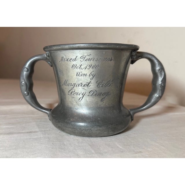 Up for sale is a rare antique bronze and pewter golf trophy. This lovely 2 handle style trophy has a beautiful form and a...