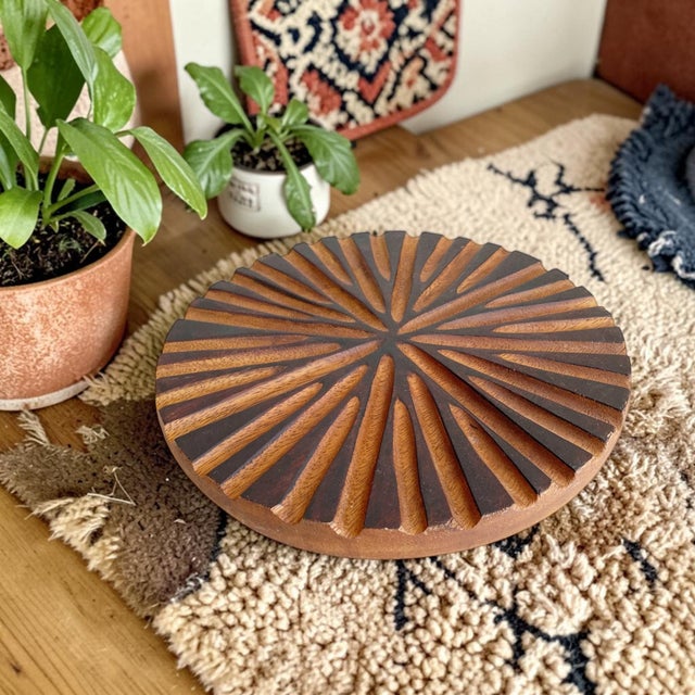 Elevate your dining experience with this Textured Wooden Round Hotplate, expertly crafted from high-quality wood to...