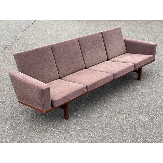 Hans J. Wegner for GETAMA GE-236 sofa. Danish Modern at its finest. Signed with burn in mark on the bottom stretcher....