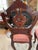Timeless and stately, this pair of Victorian parlor chairs showcases hand-carved mahogany frames with rich floral tapestry...