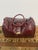 Design Plus Gallery presents a Maroon Leather Satchel Travel Bad of Embossed Printed Crocodile. A staple for any well-...