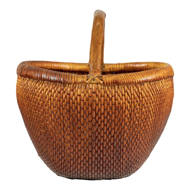 Vintage Chinese Handwoven Rattan Carrying Basket with Arched Handle For Sale