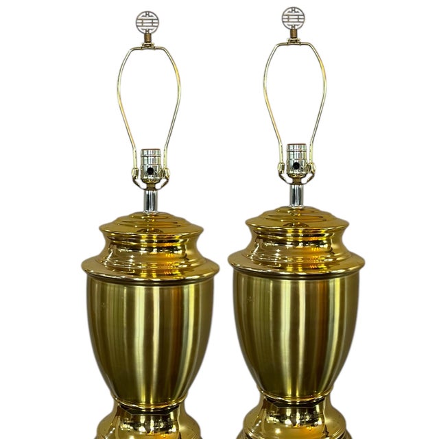 Pair of extra large brass urn lamps with new mushroom pleat shades and chinoiserie “happiness” finials. Both by Ballard...