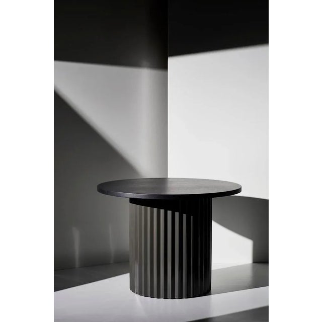 Set of 2 marble tables by Lisette Rützou. Dimensions: D 40 x H 41 cm Materials: Marble, oak tabletop, brass column....