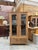This display case has been completely restored. It features two lockable glass doors and two small solid doors at the...