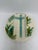 This is an antique majolica asparagus plate featuring a raised turquoise cross at the center. The cross is set against a...
