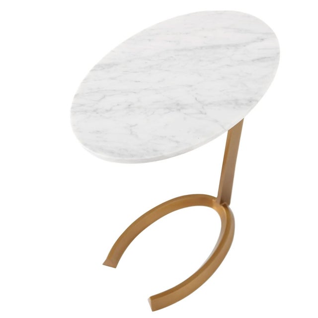 The Mineo Accent Table is a sophisticated blend of sculptural metalwork and timeless Italian marble. Featuring a canted-...