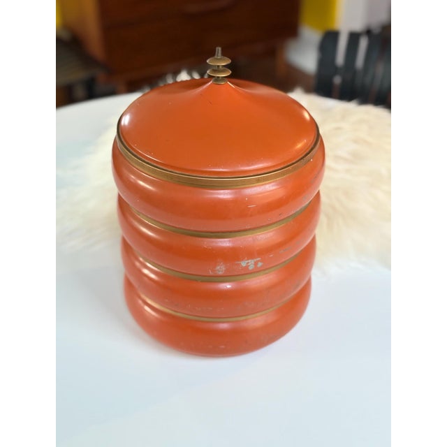 A rare atomic piece! This is an orange pagoda style canister set, stacked to perfection with a beautiful patina. Scratches...