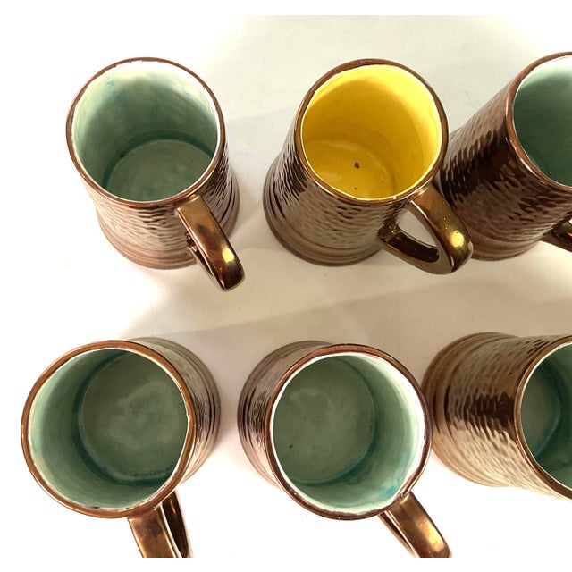 1930s 1930s Handcrafted, Artisan – Ceramic Large, Pitcher, and Eight Tankards-in a Hammered Copper Lusterware Finish - Set of 9 For Sale - Image 5 of 11