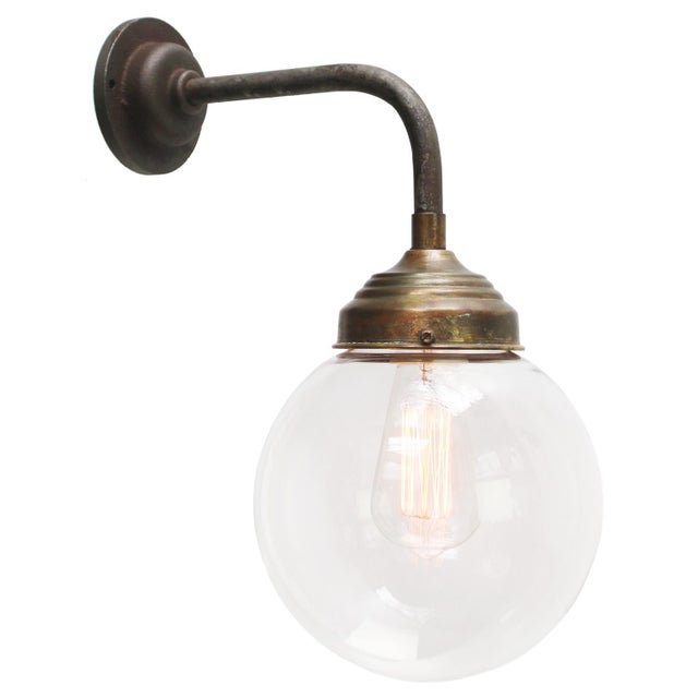 Cast Iron & Brass wall light Clear glass globe diameter cast iron wall piece: 10.5 cm / 4”, 2 holes to secure E27 / E26 Up...