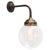 Cast Iron & Brass wall light Clear glass globe diameter cast iron wall piece: 10.5 cm / 4”, 2 holes to secure E27 / E26 Up...