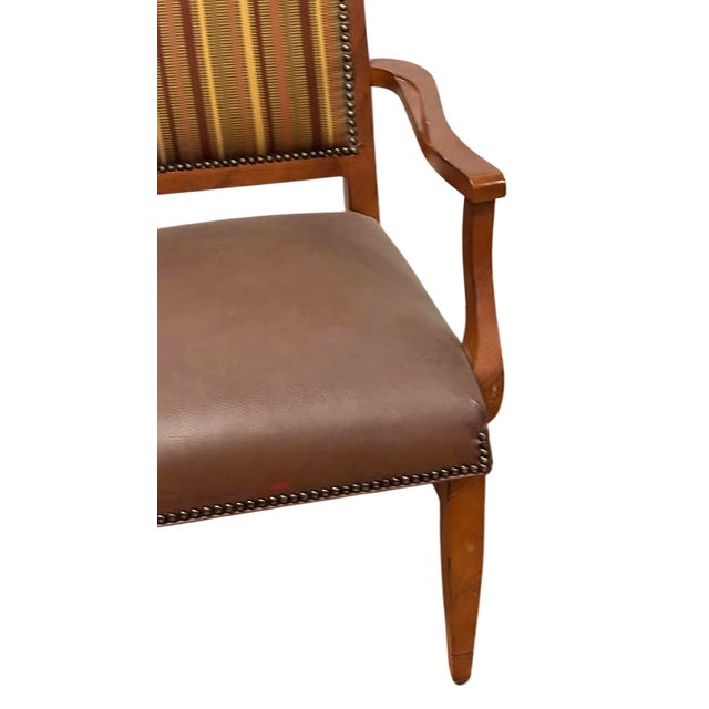 Bring timeless style and everyday comfort to your home with this handsome traditional accent chair. Crafted with a warm...