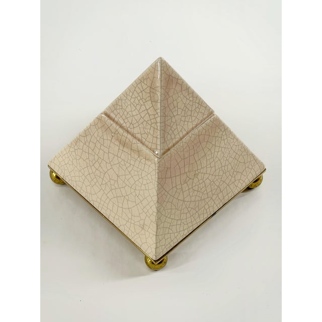 Vintage postmodern ceramic pyramid box with a crackle glaze and brass ball feet, a sculptural decor piece common in 1980s...