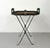 A distinctive vintage tray table by Maitland-Smith featuring a woven rattan tray top framed in dark patinated metal....