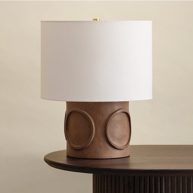 Avant-garde in both form and materiality, the Davie table lamp pairs modern inspiration with an earthy sensibility....