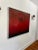 Striking, dramatic and moody oil painting on canvas and wood frame. Deep red with shades of black. Light abstract texture...