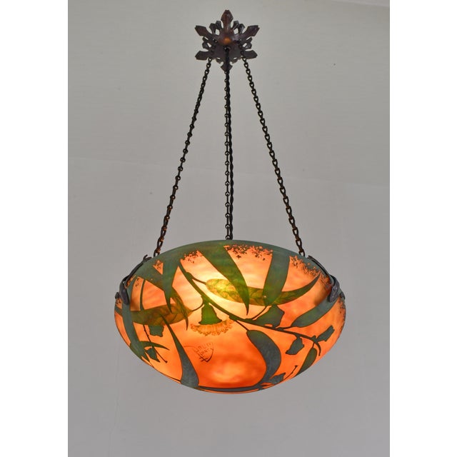 Daum freres & Louis Majorelle eucalyptus A small French art deco hanging fixture in wrought iron with a rare cameo glass...
