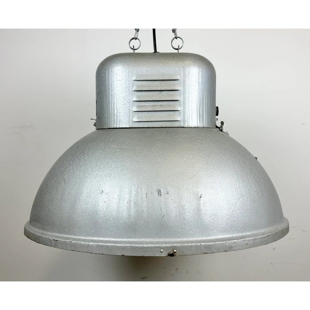 Vintage industrial hanging lamp manufactured in 1960s by predom mesko in skarzysko-kamienna in poland. It features a...