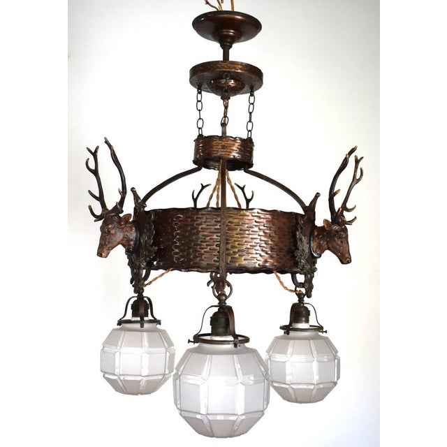 Stately chandelier from a Lower Austrian country house. Handcrafted circa 1910. Material: Brass (beautiful dark patina)...