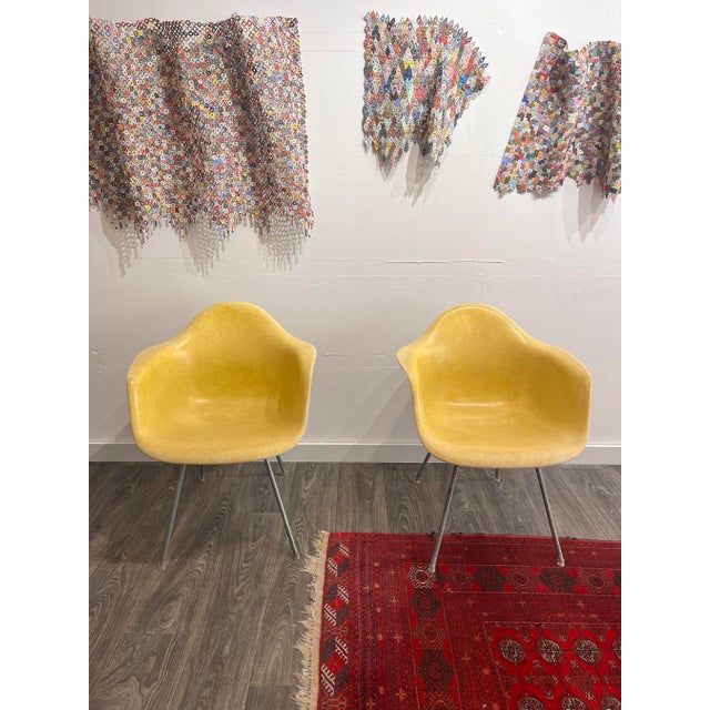 Eames For Herman Miller Mid Century Yellow Fiberglass Shell Chair A pair of Eames fiberglass DAX armchairs in lemon...