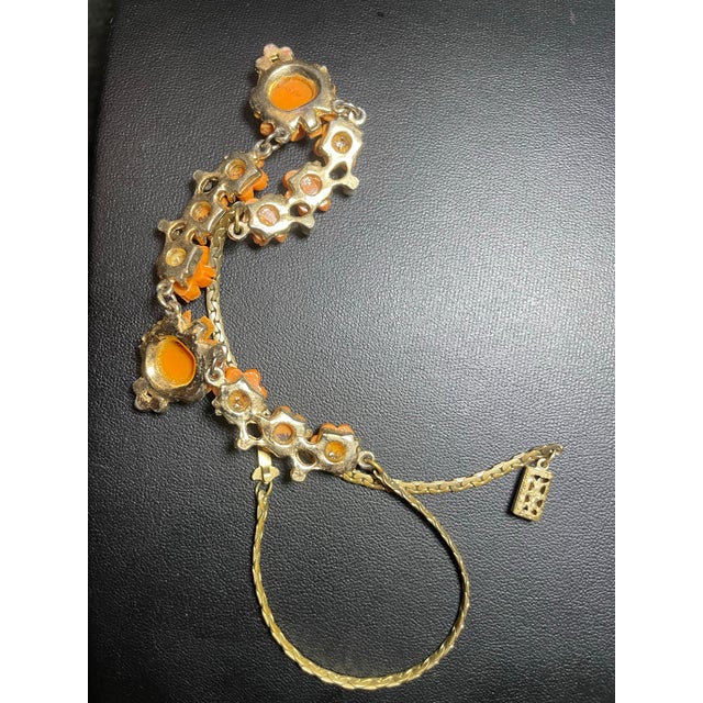 1950s faux coral necklace. Salmon-orange molded resin/thermoset plastic cabochons. Interlocking chevron/S-link flat chain,...