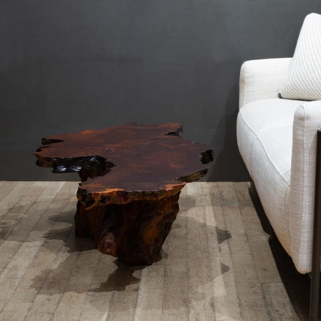 ABOUT A mid-century live-edge California redwood burl coffee table. The tabletop rests on a matching sculptural tree root...