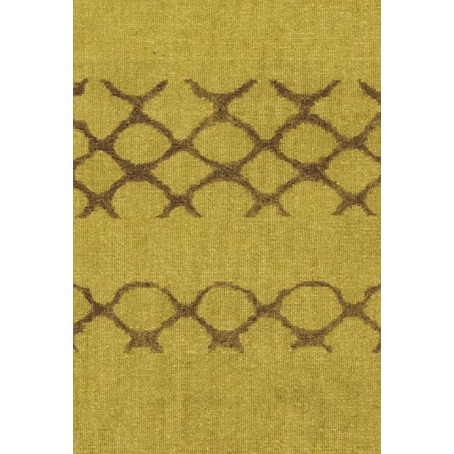 This rug is made of olive-green and purple-brown wool and was handmade in India in a Soumak flatweave. Labeled by...