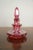 A beautiful antique Bohemian cranberry glass perfume bottle, dating to the 19th century, with faceted form, fitted...